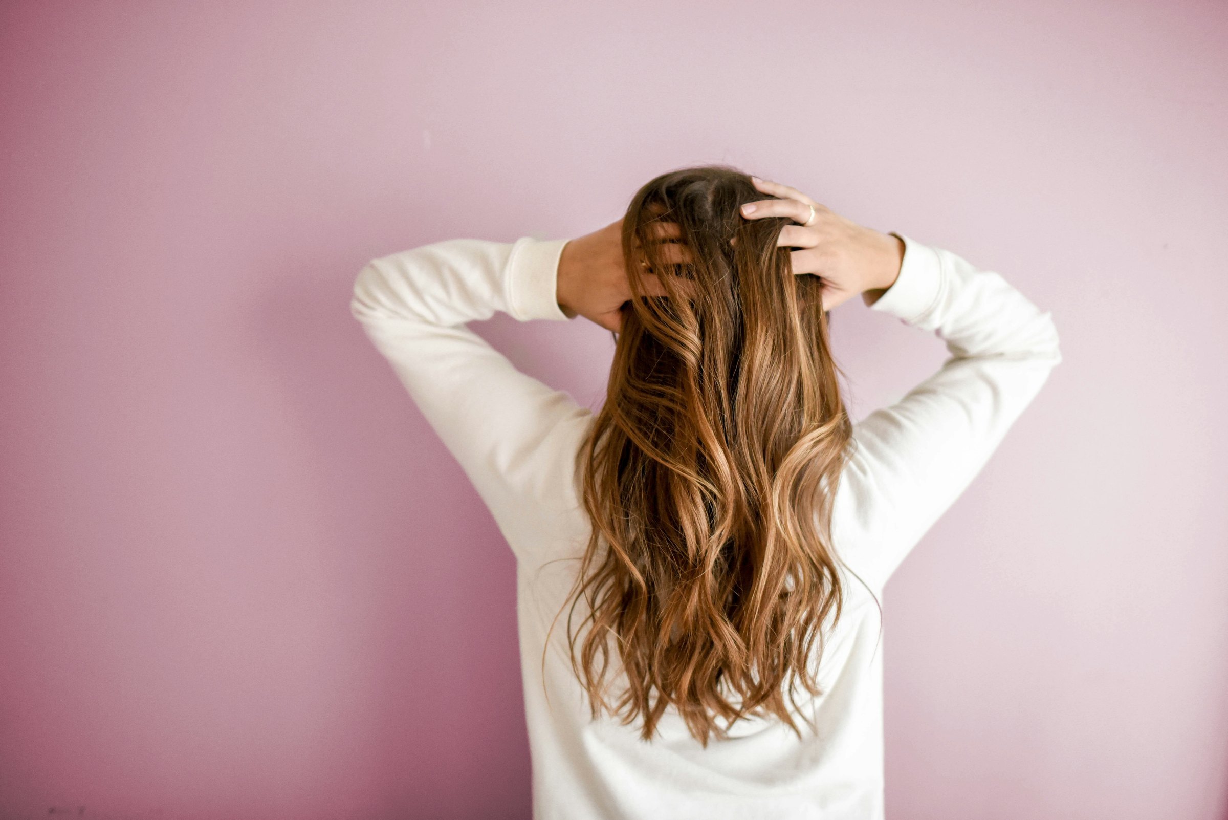 Long wavy balayage hair styled at ONIS Hair Salon, Koreatown Los Angeles